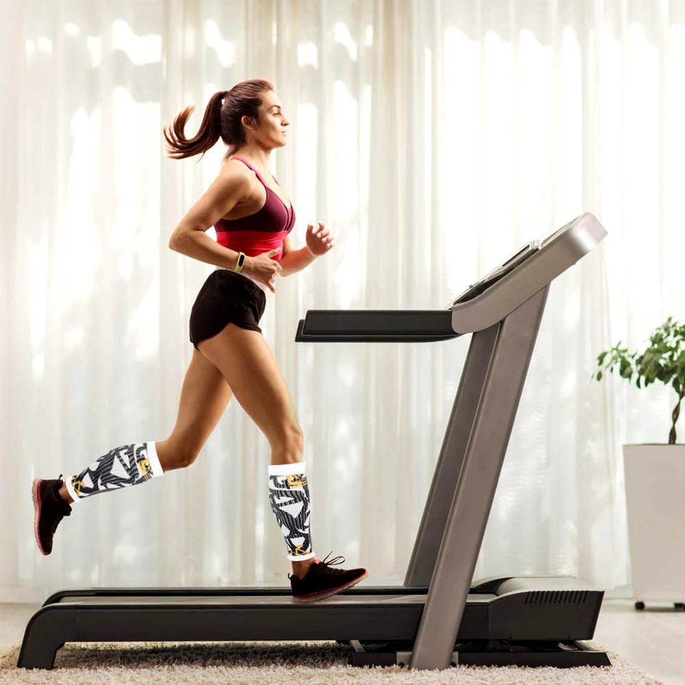 Athlete utilizing non-slip running calf sleeves to prevent lower leg swelling and muscle vibration.