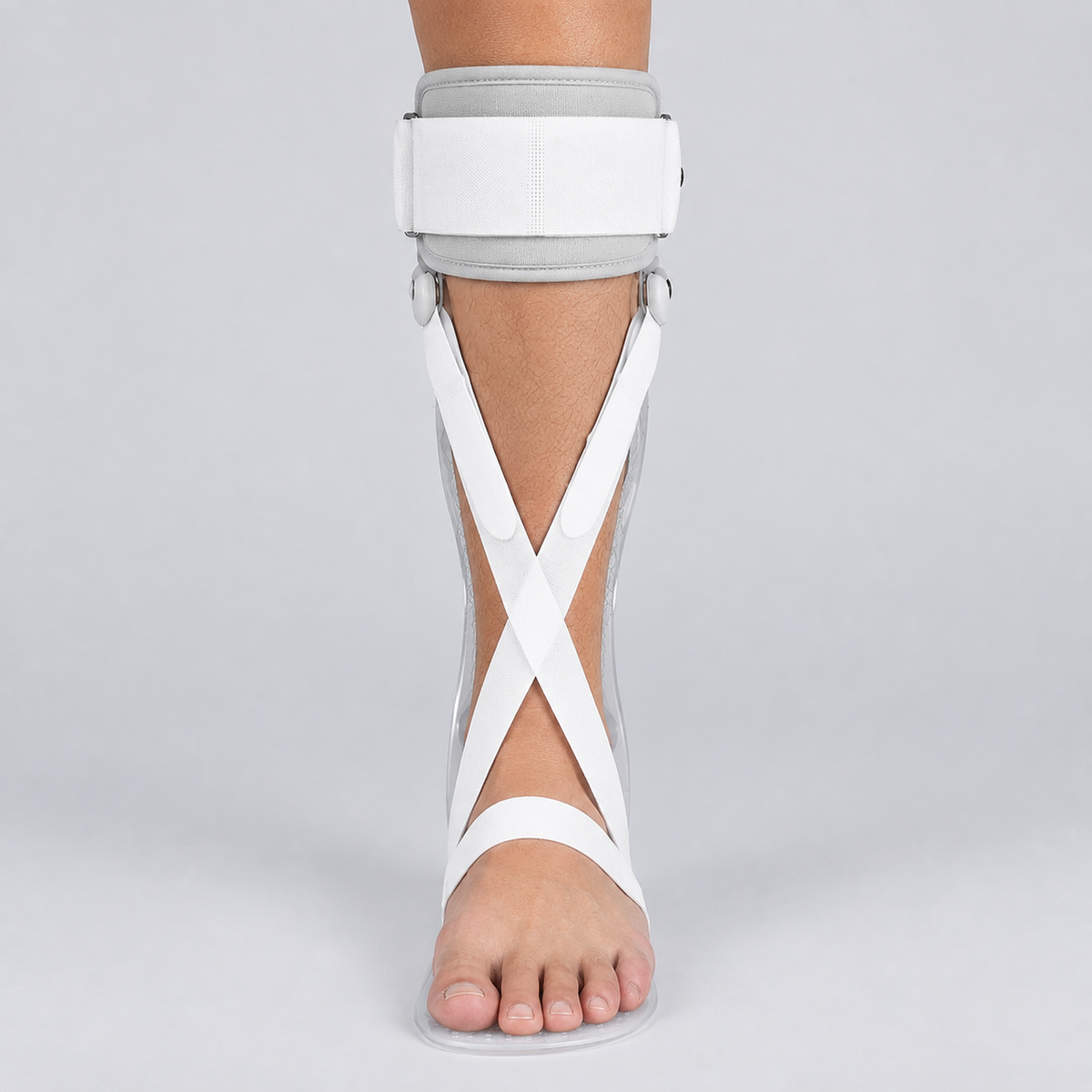 A white and gray AFO brace stroke recovery worn on a person's ankle, shown against a light gray studio background.