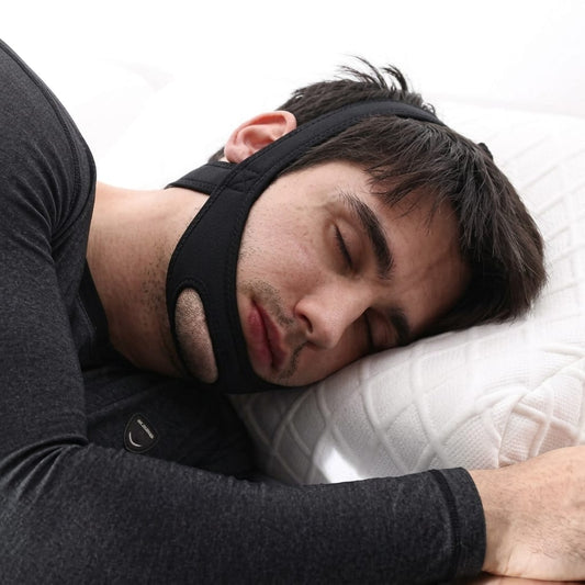 Person sleeping with a New Anti Snoring Chin Strap.