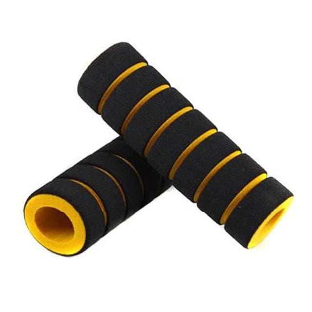 Yellow and black textured bike handlebar cover displaying its non-slip foam pattern.
