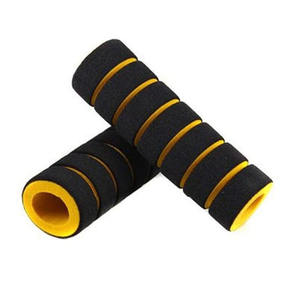 Yellow and black textured bike handlebar cover displaying its non-slip foam pattern.