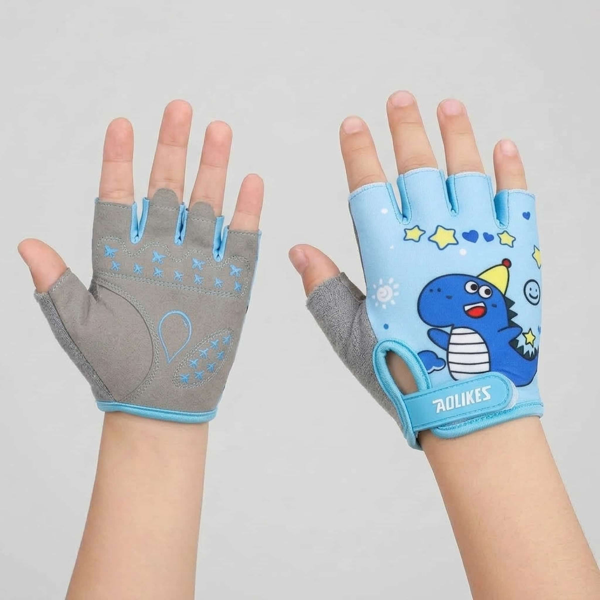 A pair of half finger kids bike gloves shown on hands against a light gray background. 