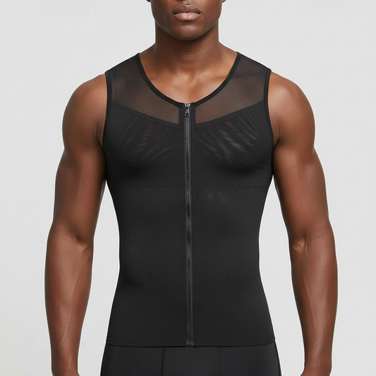 A man wearing a men's gynecomastia compression shirt chest flattener with a front zipper and sheer mesh panels, shown from the mouth down against a light gray studio background.