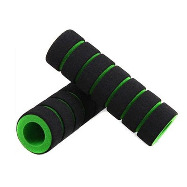Green and black shock-absorbing sponge grip detailing the clean, rounded end-cap border.