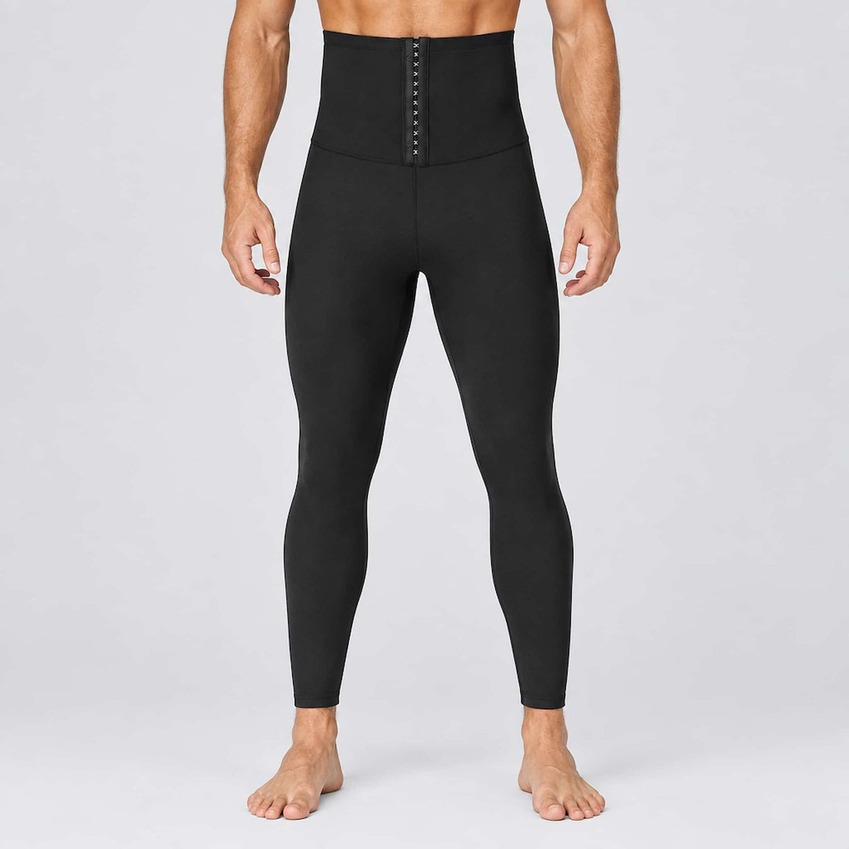 stretch sauna exercise pants, shown on a male model from the waist down against a light gray studio background.
