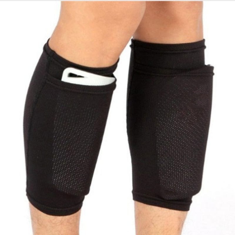 An athlete wearing white compression football socks.