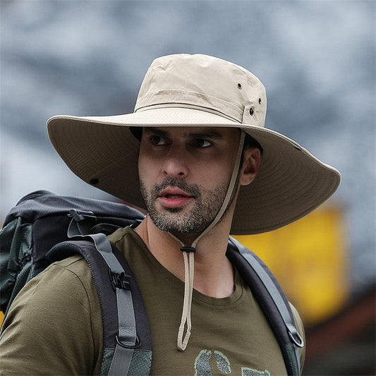 Close-up of a men's khaki wide-brim sun protection hat with breathable mesh side panels and an adjustable chin strap toggle