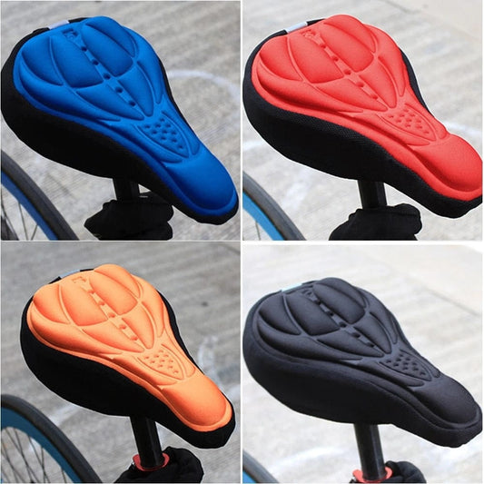 Red, blue, orange, and black non-slip padded bike seat covers displayed together.