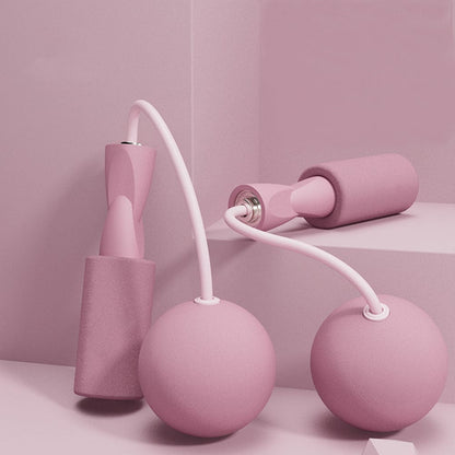 Pink cordless jump ropes with weighted ball attachments and EVA foam handles.